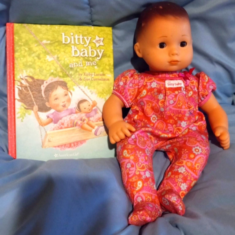 American Girl Bitty Baby with book.